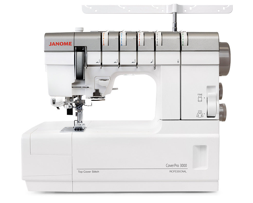 Machine à coudre recouvreuse Janome CoverPro 3000 Professional – Vue complète de la recouvreuse avec ses guides de fils colorés et son design professionnel.