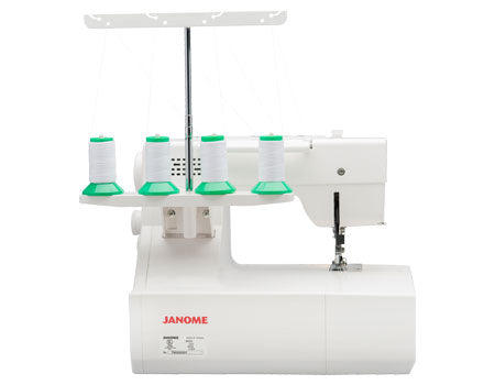 Machine à recouvrement Janome CoverPro 2000CPX vue de l’arrière, présentant le support à bobines avec quatre fils prêts à être utilisés pour une couture précise.